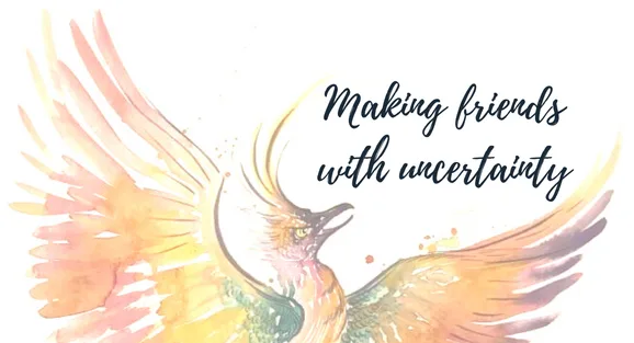 Watercolour phoenix with the words “Making friends with uncertainty”